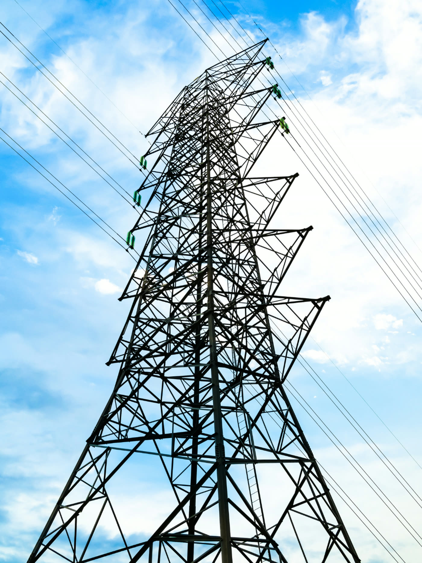 High-voltage transmission tower against the sky